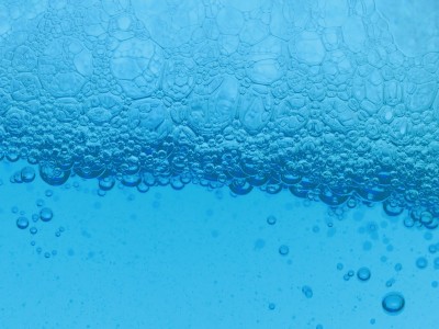 Blue liquid with many bubbles.