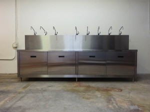 Stainless steel sink and cabinet unit.
