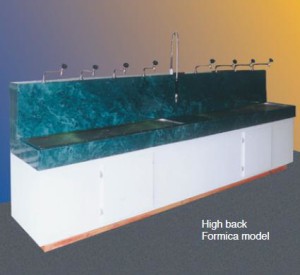 High-back Formica sink unit with taps.