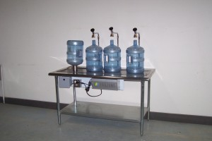 Water filtration system with four jugs.