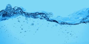 Blue water with bubbles and waves.